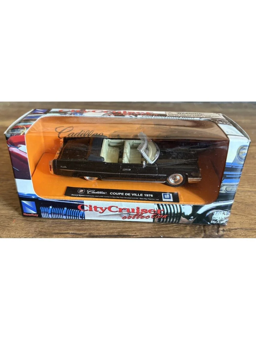 1976 Cadillac Coupe DeVille Convertible in Black - 1:43 New Ray City Cruiser